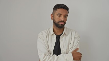 Poster - Young african american man, looking tired and bored, thinking about his problems, depressed, standing with arms crossed, wearing a shirt, isolated over a white background