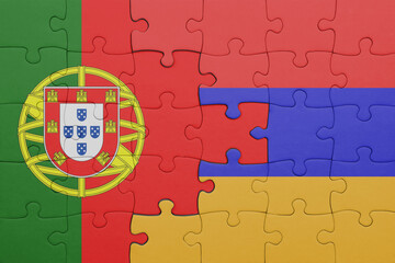 puzzle with the colourful national flag of armenia and flag of portugal .