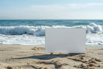 Wall Mural - A white card is sitting on the sand at the beach