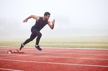 outdoor, exercise and man running at track for fitness, sports and training for competition. mist, f