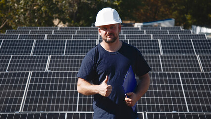 Wall Mural - A chief engineer oversees the installation of solar panels on a rooftop. The scene highlights expert supervision and modern renewable energy solutions in action.