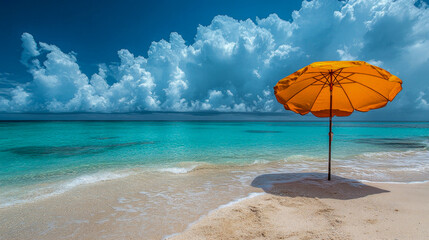 Wall Mural - Single yellow sunshade is standing on a pristine beach with turquoise water and a cloudy sky