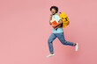 © ViDi Studio - Full body side view young happy Indian boy student wear blue t-shirt casual clothes backpack bag hold books jump high run fast isolated on plain pink background High school university college concept