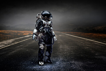 Wall Mural - astronaut walking on an unexplored planet