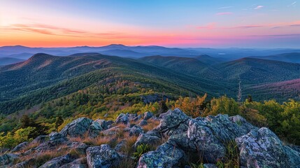 Wall Mural - A view of a mountain range at sunset.