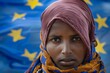 © S - Refugee woman's sorrow mirrored eu flag's stars behind her. Portrait of somali woman's resilience and adversity european flag. Citizens in EU express frustration over changing neighborhoods.