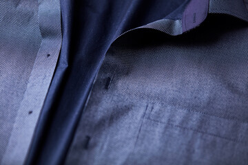 Wall Mural - Close up of dark Men's shirt. Soft focus. Copy space.