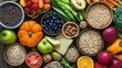 © SETSU ST - Top view of a variety of fresh fruits and vegetables arranged alongside whole grains and lean proteins. Copy space available