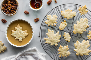 Wall Mural - Preparing freshly baked maple pecan shortbread cookies with a maple glaze.