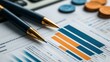 © Supranee - Close-up of pens resting on financial reports with charts and coins, representing analysis and business strategies.