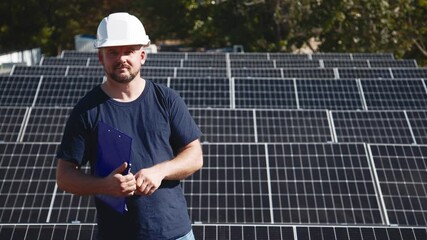 Wall Mural - A chief engineer oversees the installation of solar panels on a rooftop. The scene highlights expert supervision and modern renewable energy solutions in action.