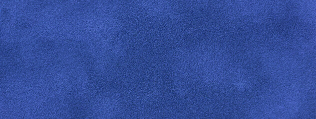 navy blue matte background of suede fabric, closeup. velvet texture of seamless sapphire textile, ma