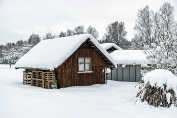 Wall Mural - garden in winter, covered with snow, fruit trees, garden house and garden accessories