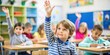 © InspireStock Gallery - Close up of a curious child raising hand to ask question during a classroom lesson, curious, child, raise hand, ask