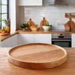 © James H Becker - Balcão de mesa de madeira com suporte de madeira redondo disposto no interior de uma cozinha clara. Mockup para exibição de produtos.