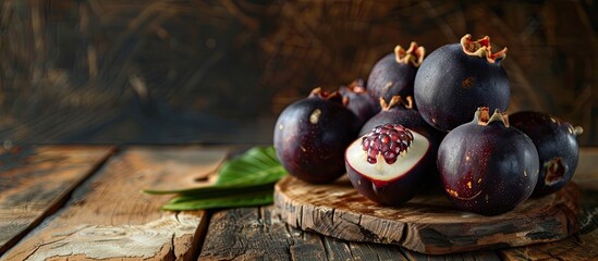 Wall Mural - Organic mangosteen displayed on the table with copy space image.