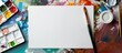© StockKing - Mockup paper for watercolor art display with a paintbrush and palette on a blank sheet in a top-view copy space image.