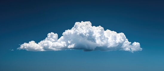 High resolution photo of a white cumulus cloud in a dark blue daytime sky, perfect for copying as a copy space image.