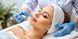 © InspireStock Gallery - Cosmetologist performing mesotherapy injection with dermapen for facial rejuvenation at a spa center, cosmetologist