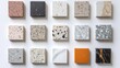 © KumCup - A selection of sixteen marble and granite samples laid out in a grid pattern showcasing various colors and textures.