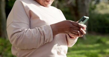 Wall Mural - Senior woman, smartphone and texting in park, communication and excited with sunrise, flare and typing. Happiness, social media and good news in outdoor, tech and message with online conversation