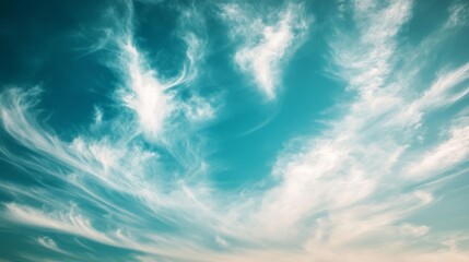 Poster - Soft focus green and blue sky with wispy clouds