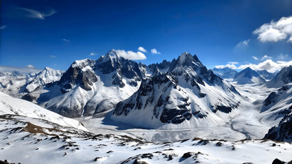 Sticker - A panoramic view of a snowy mountain range under a clear blue sky