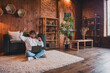 © deagreez - Photo of funky lucky guy dressed white pullover winning game modern gadget indoors house apartment room