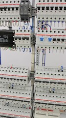 Wall Mural - An electric switchboard with automation modules and automatic current switches. 