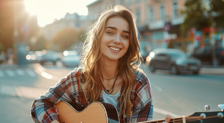 Canvas Print - A young woman is playing the guitar on an urban street, smiling and looking happy as she strums the strings