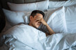 © kieferpix - Sleepless man lying in bed feeling tired stressed