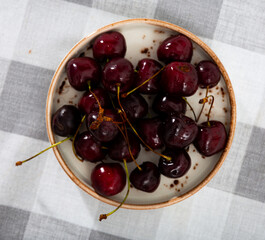 Wall Mural - Delicious sweet cherry berry served on plate to table