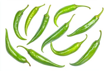 A slice of green hot chili falling in the air, surrounded by spices and herbs for garnish and seasoning.