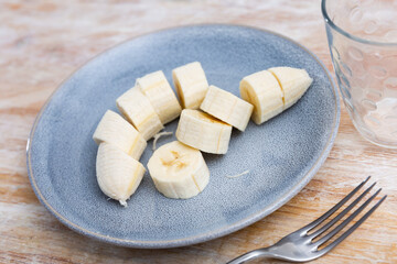 Wall Mural - Sliced sweet banana fruit served on plate for dessert