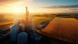© busro - Detailed overhead photograph of an ethanol plant in a rural setting, featuring a mix of large storage tanks and production units. The farmland surrounding the factory is visible, with fields