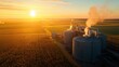 © busro - Detailed overhead photograph of an ethanol plant in a rural setting, featuring a mix of large storage tanks and production units. The farmland surrounding the factory is visible,