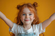 © sofiko14 - Cheerful girl with red hair smiling against yellow background