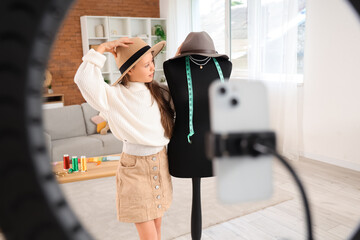 Sticker - Teenage fashion blogger with mannequin recording video at home