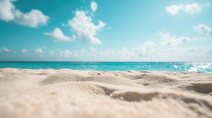 Wall Mural - Closeup of sandy beach with turquoise sea and sky background