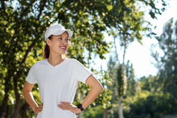 Sticker - Beautiful young happy sporty Asian woman in park outdoors