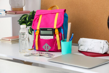 Sticker - Stylish children's workplace with globe, laptop and school bag in room