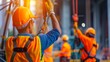© suntaree - Construction worker lifting heavy materials using a crane, demonstrating the scale and complexity of the construction project with a focus on safety gear and machinery in the background