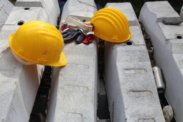 Wall Mural - yellow helmet on a work site