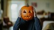 © Tapanut - Person wearing a pumpkin head struggling to see, space for text