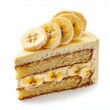 © MIN_NK - A slice of banana cake with whipped cream and banana slices on top.  The cake is light and fluffy, and the banana slices are fresh and juicy.