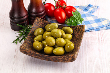 Green marinated olives in the bowl