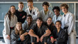 © Mahemud - Coaches and students posing in a martial arts studio.