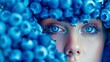 © Viktor - A woman with a blue floral headband and intensely blue eyes, captured in a close-up shot