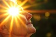 © Sergey - Golden hour portrait of serene elderly woman embracing sunlight