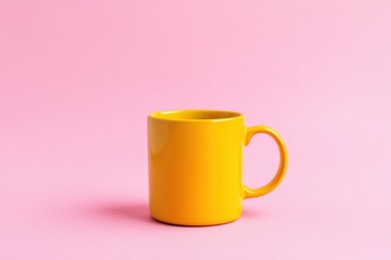 Vibrant yellow mug on soft pink background